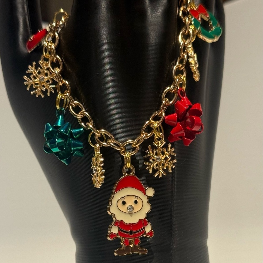 Festive Gold Charm Bracelet with Santa and Bows